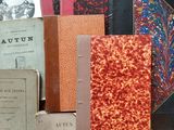 many books that are sitting on a table together