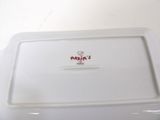 a white plate with a red and white design on it
