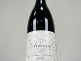 a close up of a bottle of wine on a table