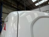 an image of a white train in a train station