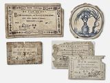plusieurs vieux morceaux de papier sur lesquels figure le portrait d'une femme