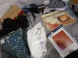 a lot of items that are on the bed