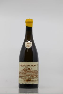 a close up of a bottle of wine on a table