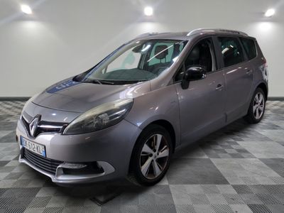 a picture of a silver car parked in a garage