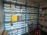 a room filled with lots of boxes and boxes on shelves