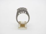 a white gold and diamond ring on a white background