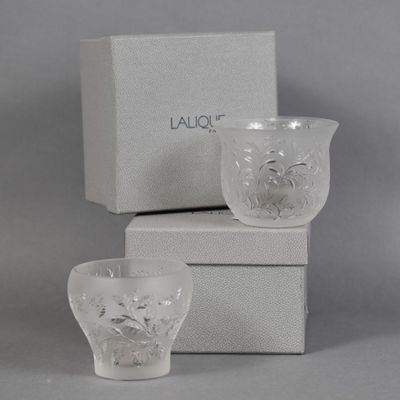 a glass cup and a box on the table