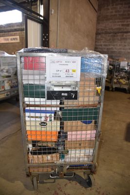 a metal cart with many items in it in a warehouse