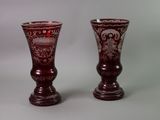 two vases that are sitting next to each other on a table