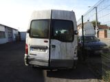 a white van that is parked in a parking lot