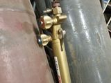 a close up of a propanent with a hose attached to it