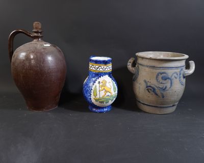 three different vases sitting next to each other on a table