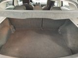 the trunk of a car with the seat folded down