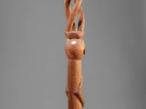 an image of a wooden walking stick with a twisted design on it