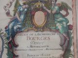a framed picture of a coat of arms with a picture on it