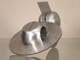 a metal object that is sitting on a glass table