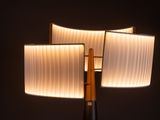 two lamps that are lit up in the dark