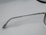 a close up of a pair of sunglasses on a white surface