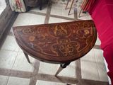 a small table with a design on it in a room