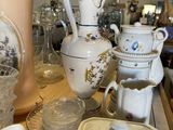 many different types of vases and bowls on the table
