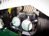 a close up view of the engine of a green and white car