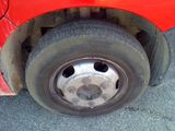 a close up of a tire on a red car