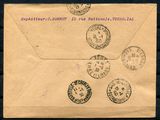 an old envelope with stamps on it sitting on top of a table