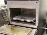 an oven that has a tray of food inside of it