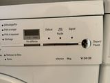 an image of a white washer and dryer in a kitchen