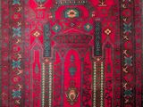 a red rug with a design on it