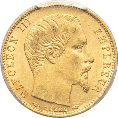gros plan d'une pièce d'or sur laquelle figure le visage d'un homme