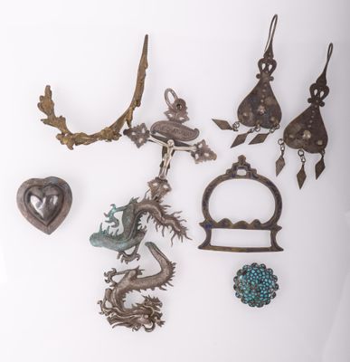 several pieces of jewelry are displayed on a white surface