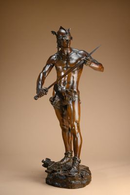 bronze statue of a man holding a knife and a sword