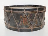 a drum that is sitting on a white surface