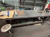 a workbench in a workshop with a lot of tools