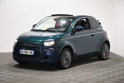 a picture of a small blue car parked in a room