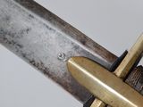 a close up of a sword with a cross on it