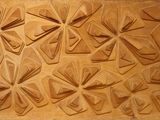 a close up of a carving of flowers on a wall