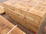 several pieces of wood are stacked on top of each other on the ground