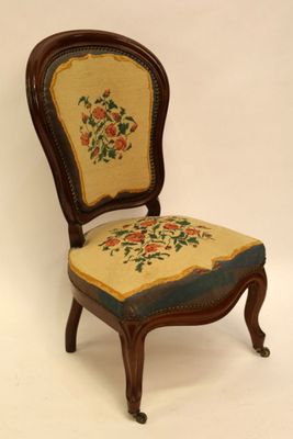 an image of a chair with a floral upholstered seat