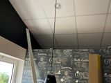 a black and white wall with writing on it in a room