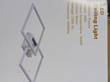 a white box with a silver diamond on it
