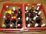 plusieurs bouteilles de vin dans une caisse rouge