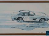tableau représentant une voiture de sport argentée, encadré dans un cadre en bois et accroché au mur