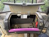 a trunk of a vehicle with a purple seat belt