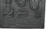 a close up of a plaque with animals and plants on it