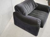 an image of a grey couch in a room