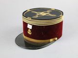 a red hat with gold trim and a skull and crossbone on it