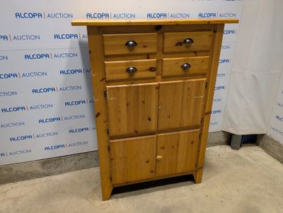 une photo d'une armoire en bois surmontée de quatre tiroirs