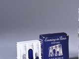 a bottle of cologne next to a small box of cologne